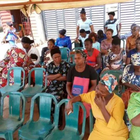 A close-up view of dough rings and bowls of dough prepared on a blue table.