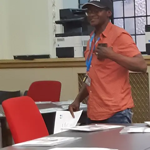 A group of guests seated at a formal round table.