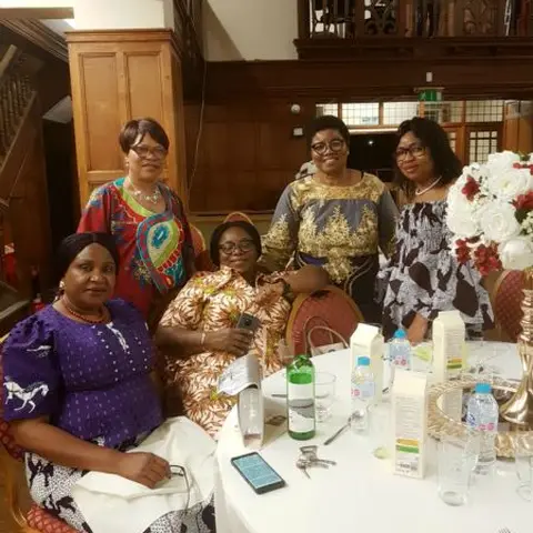 Participants engaging in a discussion or workshop activity in a classroom-style setting.